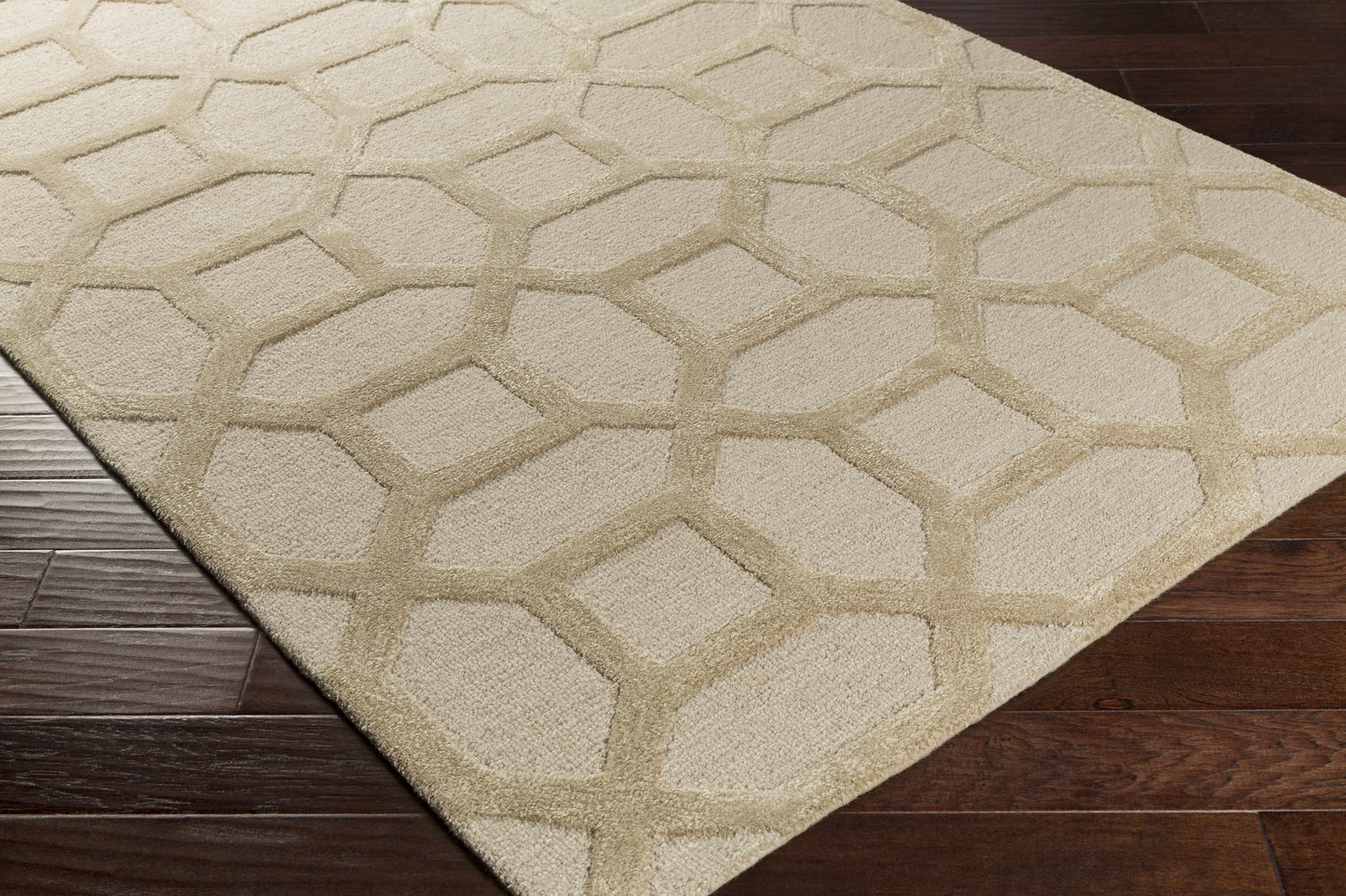 Ivory beige Dodgertown Area Rug shown on dark hardwood floor, highlighting its hand-tufted wool texture and contemporary design.