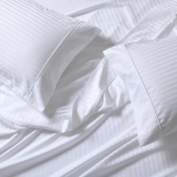 CinchFit American Made split-top king sheets styled on an adjustable bed