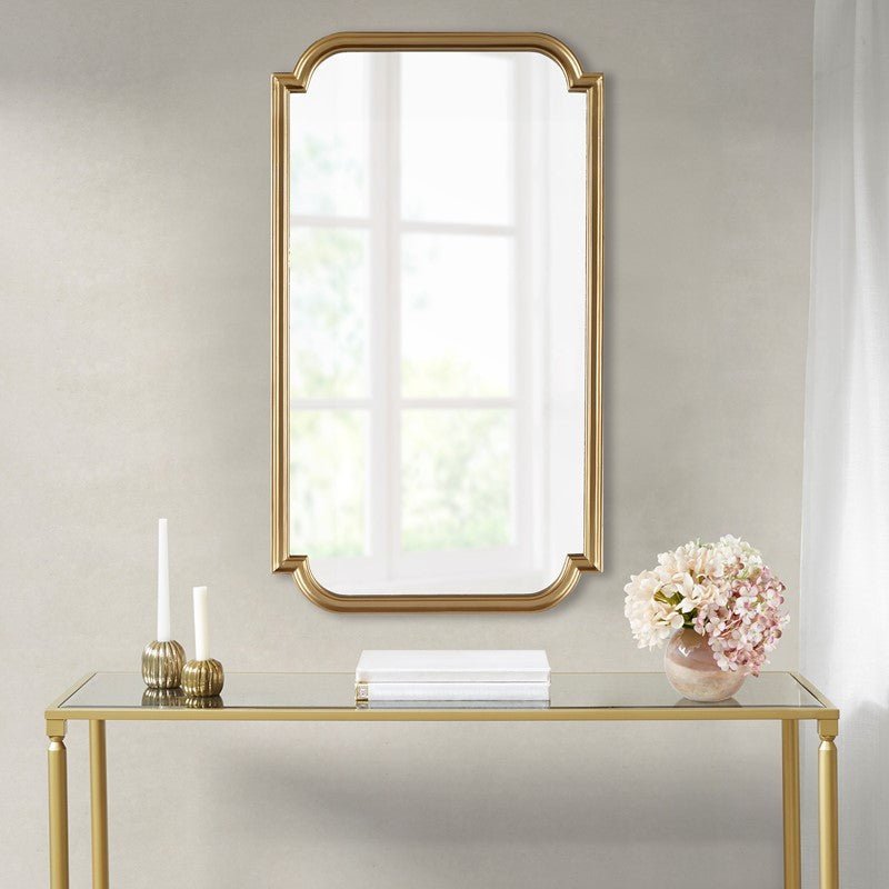 Adelaide rectangular wall mirror with a gold frame and softly scalloped corners.