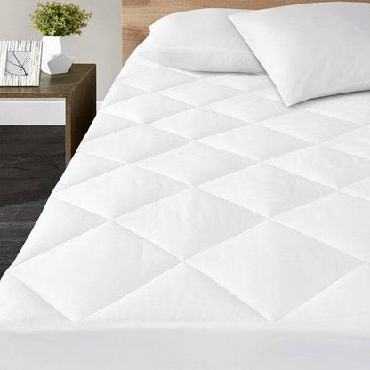Close up of the quilting and stitched edge on the hand sewn shallow pocket mattress pad