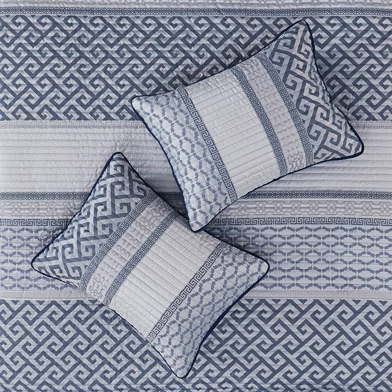 Top view of pillows and quilt from Universal V Berth Navy Blue Bennett Quilt Cover Set. Shop yacht bedding with coastal patterns in navy and grey.