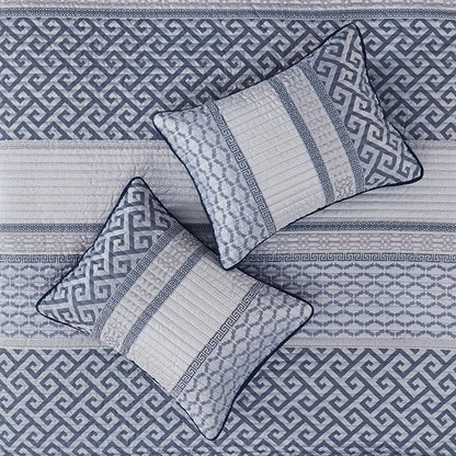 Top view of pillows and quilt from Universal V Berth Navy Blue Bennett Quilt Cover Set. Shop yacht bedding with coastal patterns in navy and grey.