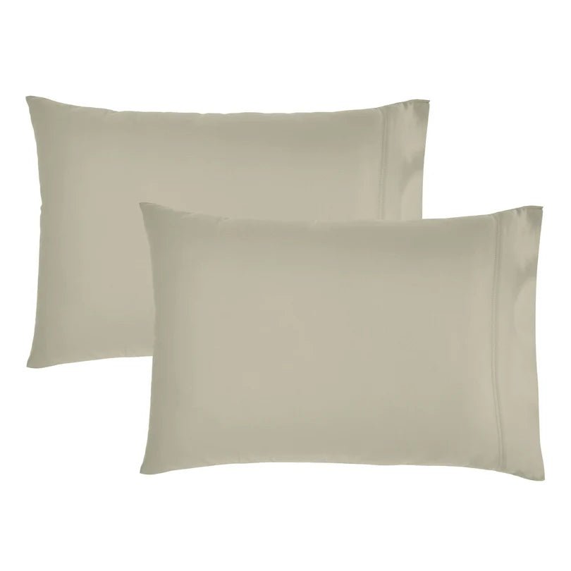 Two plain pillowcases in a light warm gray-beige color, shown overlapping on a white background.