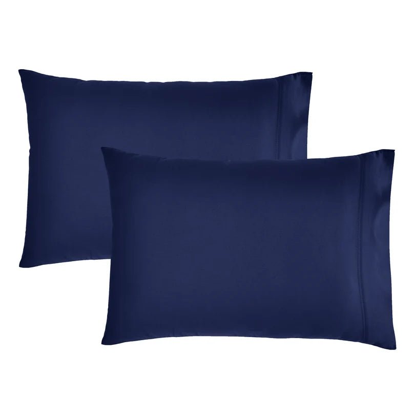Two navy blue pillowcases shown on a plain white background, with one slightly behind the other.
